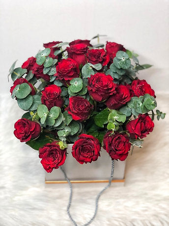Enchating Arrangement of Fresh Red Roses in a Box