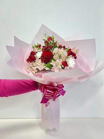 Beauteous Fresh Mixed Flowers Bouquet in a Pink Wrapper