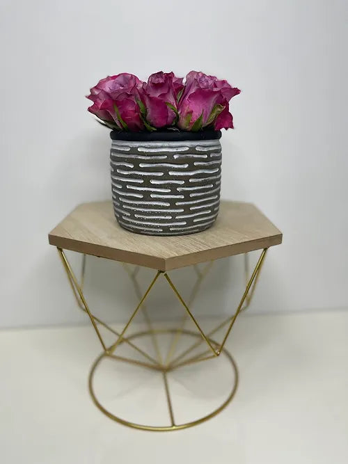 Purple Roses in a Ceramic Vase