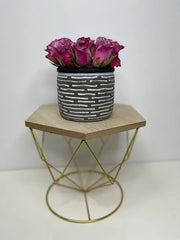 Purple Roses in a Ceramic Vase