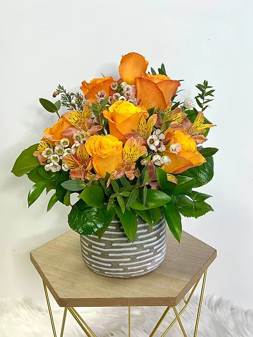Orange Flowers in a Ceramic Vase