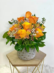 Orange Flowers in a Ceramic Vase